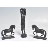 A group of three cast bronze 19th Century Grand Tour figurines to include two horses each raised