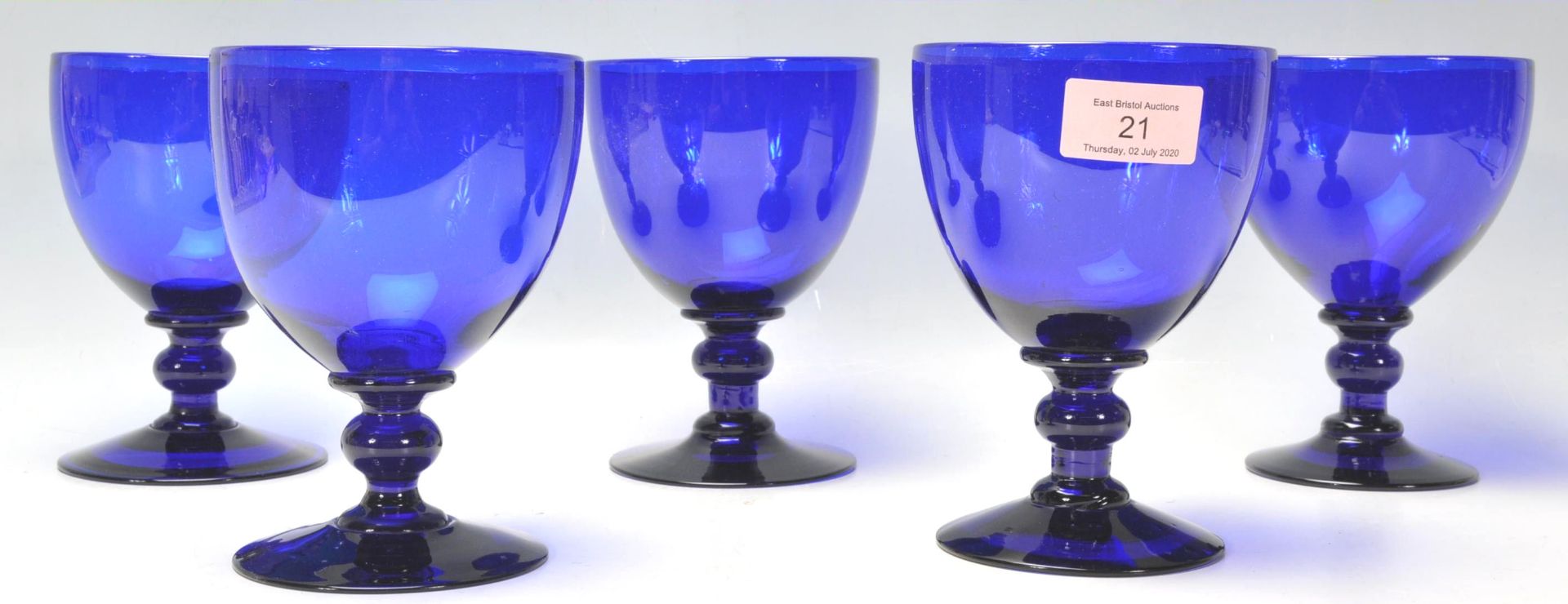 A set of five vintage 20th Century large cobalt blue glass wine glasses / rummers having round bowls