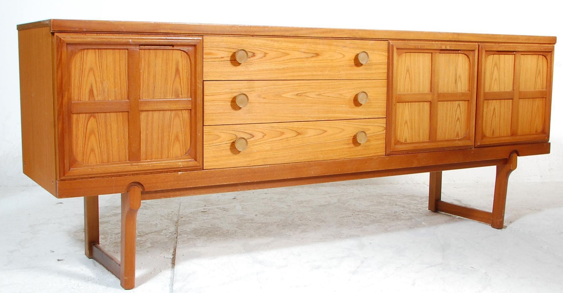 Nathan Furniture - A retro mid 20th Century teak wood sideboard credenza having a central bank of