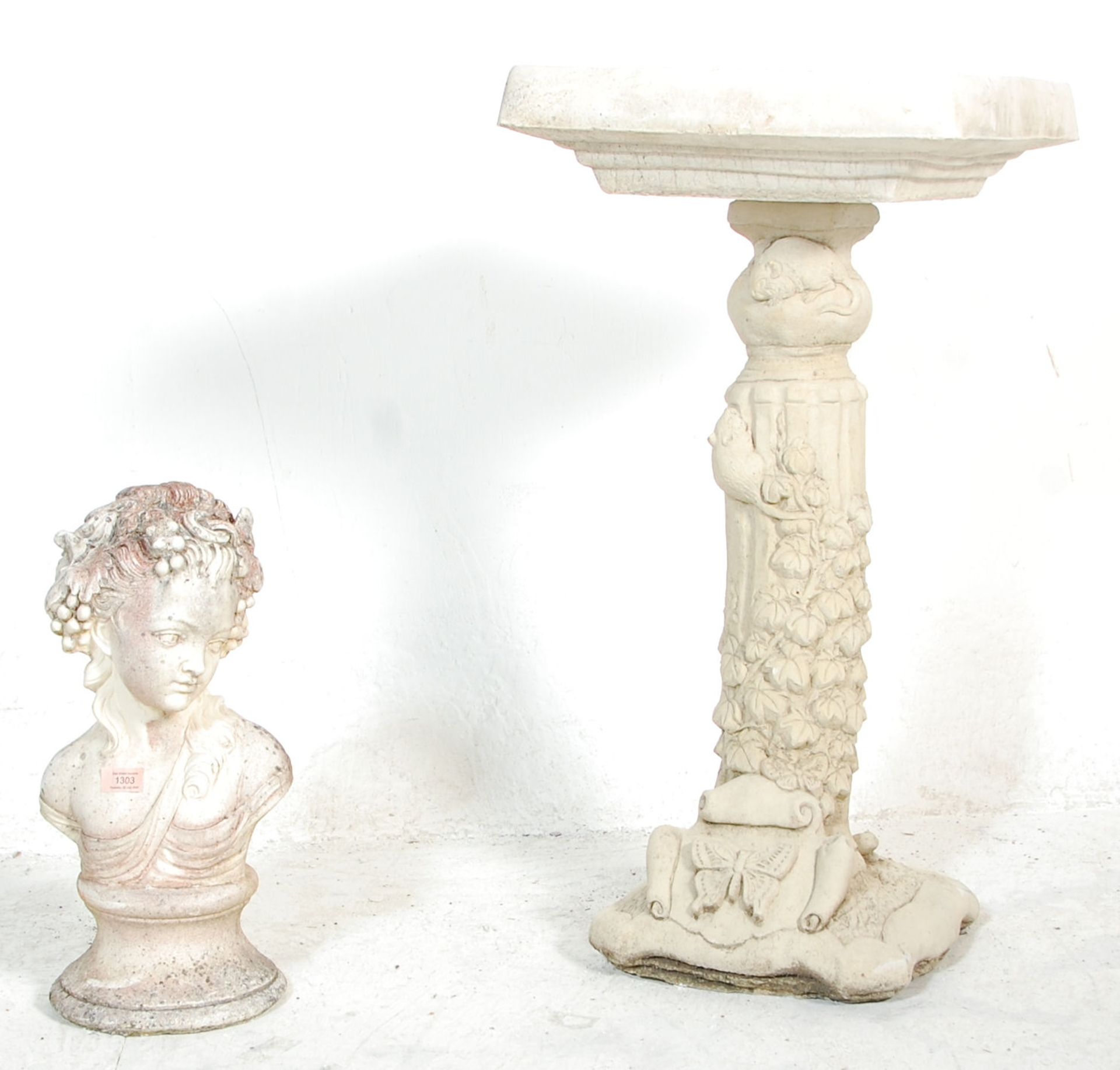 Two 20th Century reconstituted stone garden ornaments to include a classical style bird table in the