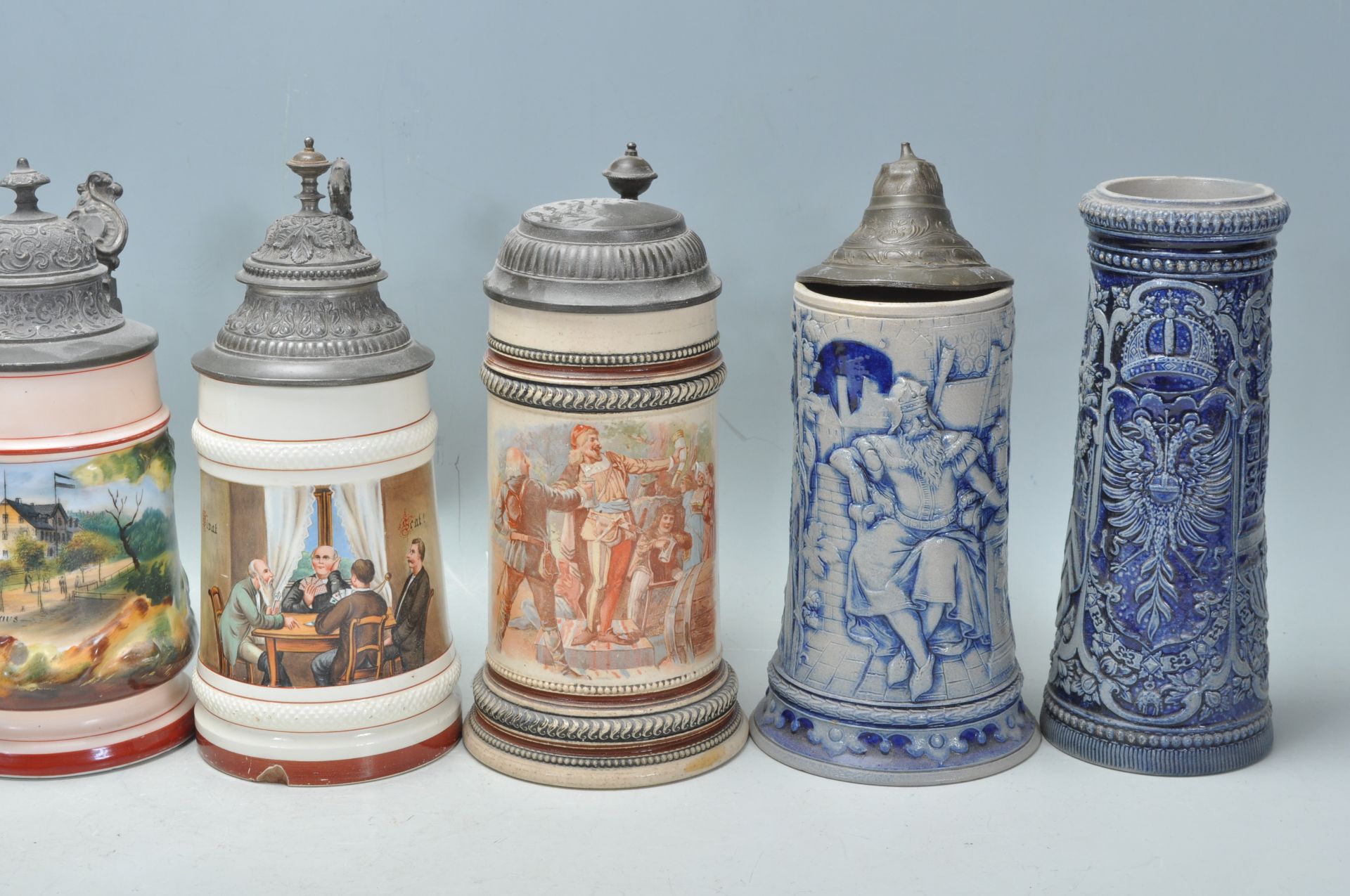 A collection of 20th Century German ceramic stein drinking glasses, many having raised blue and grey - Bild 9 aus 9