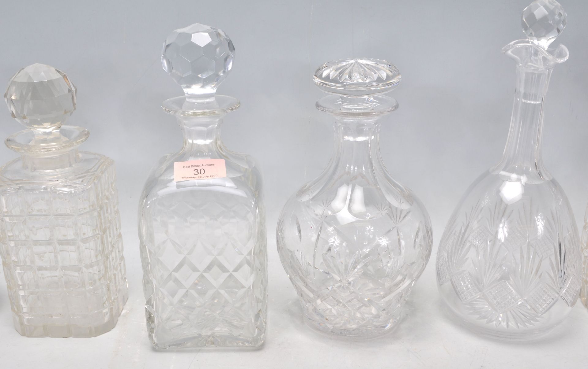 A group of seven vintage and antique cut glass decanters to include a pair of whiskey decanters with - Bild 3 aus 11