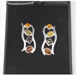 A pair of stamped sterling silver earrings set with amber, citrine and other semi precious stones
