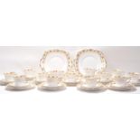 A Fine Bone China English tea service by Roslyn China having floral banded borders comprising twelve