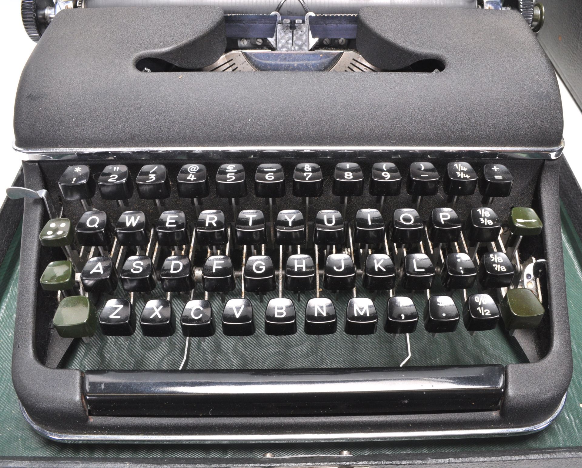 A vintage 20th Century Olympia typewriter having a black matte ebonised metal body with black typing - Bild 3 aus 7