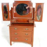 A 19th Century Victorian mahogany dressing table chest of drawers having a tri fold mirror top