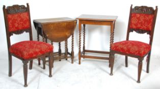 A 1930's oak drop leaf occasional table having an oval top raised on barley twist legs united by