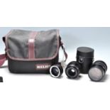 A group of camera lenses to include a Carle Zeiss Jena DDR MC Flektogon 2,4/35 lens, Carenar HOYA