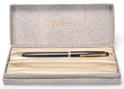 A vintage Mont Blanc 344 fountain ink writing pen having a black plastic body with gilt banding