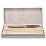 A vintage Mont Blanc 344 fountain ink writing pen having a black plastic body with gilt banding