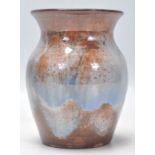 EWENNY POTTERY - A Studio Art Pottery vase of globular tapering form having a flared rim atop with a
