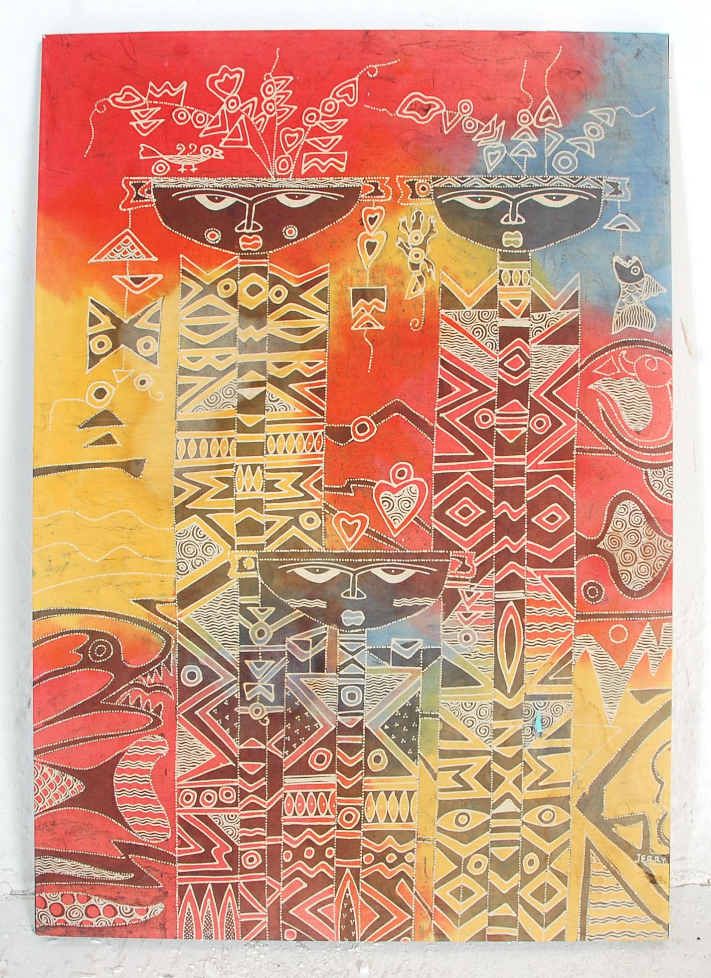 A mid 20th Century African Tribal dyed fabric print depicting stylised faces / figures with