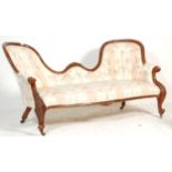 A 19th century Victorian mahogany double scroll end Chesterfield conversation sofa settee. Raised on