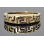 A stamped 585 14ct gold ring having pierced greek key decoration. Weight 1.8g. Size K.