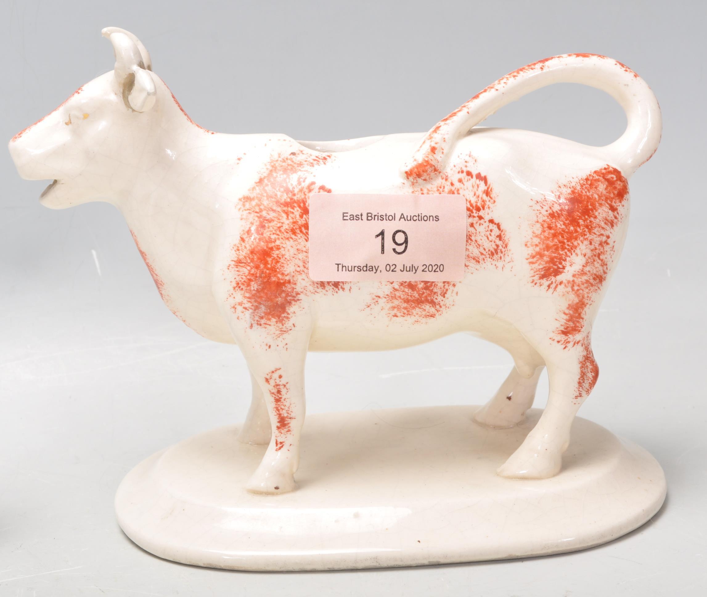 A 19th Century Victorian Staffordshire pottery sponge decorated creamer jug in the form of a cow, - Image 7 of 8
