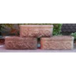 A group of three antique reconstituted stone planters of rectangular form having raised floral