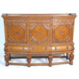 A good 1930's large early 20th Century Elizabethan style oak court cupboard sideboard raised on four