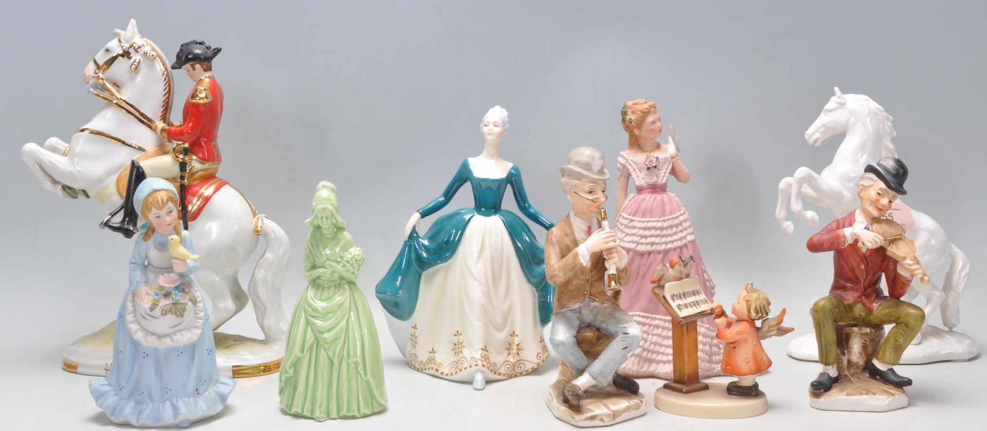 A collection of 20th Century ceramics figurines to include an Austrian Hans Poelzer porcelain