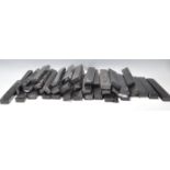 A collection of 35 black plastic necklace cases of rectangular form all containing cushioning