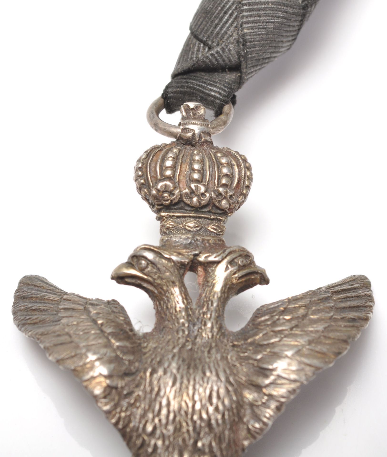 A 20th century cast metal Masonic double headed eagle medal modelled with a crown and holding a - Bild 3 aus 6