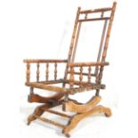 A Victorian 19th century walnut Boston rocking chair / armchair raised on angled sprung supports