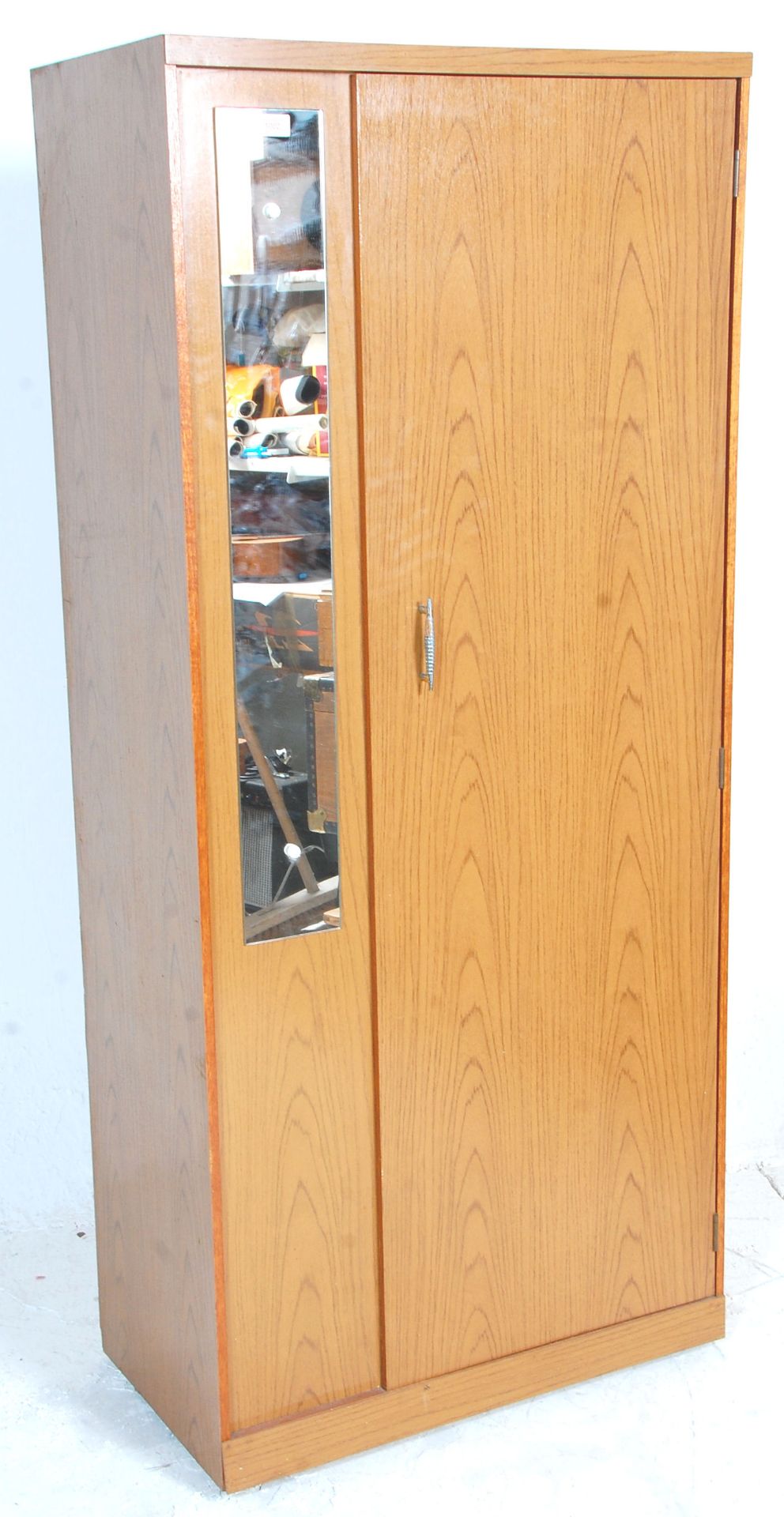 A retro vintage 20th Century teak melamine effect wardrobe of good small proportions having a single