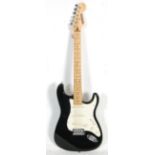 A Fender Stratocaster style Bluerock six string electric guitar having three control knobs with a