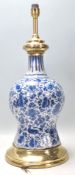 Abn 18th Century Delft blue and white ceramic lamp of waisted form having hand painted floral and