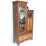 A Victorian 19th century Art Nouveau mahogany drop centre double wardrobe having a tall hanging