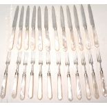 A twenty four piece English silver hallmarked dessert cutlery set having mother of pearl handles