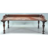 A 19th century Victorian mahogany butlers / breakfast tray with a raised  gallery back and edge with