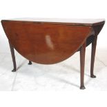 A 19th Century Georgian mahogany pad foot drop leaf gateleg table of oval form.