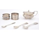 A group of silver hallmarked wares to include a late Victorian mustard pot raised on ball feet,