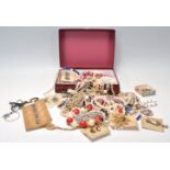 A collection of vintage costume jewellery to include mid Century gilt brooches and earrings