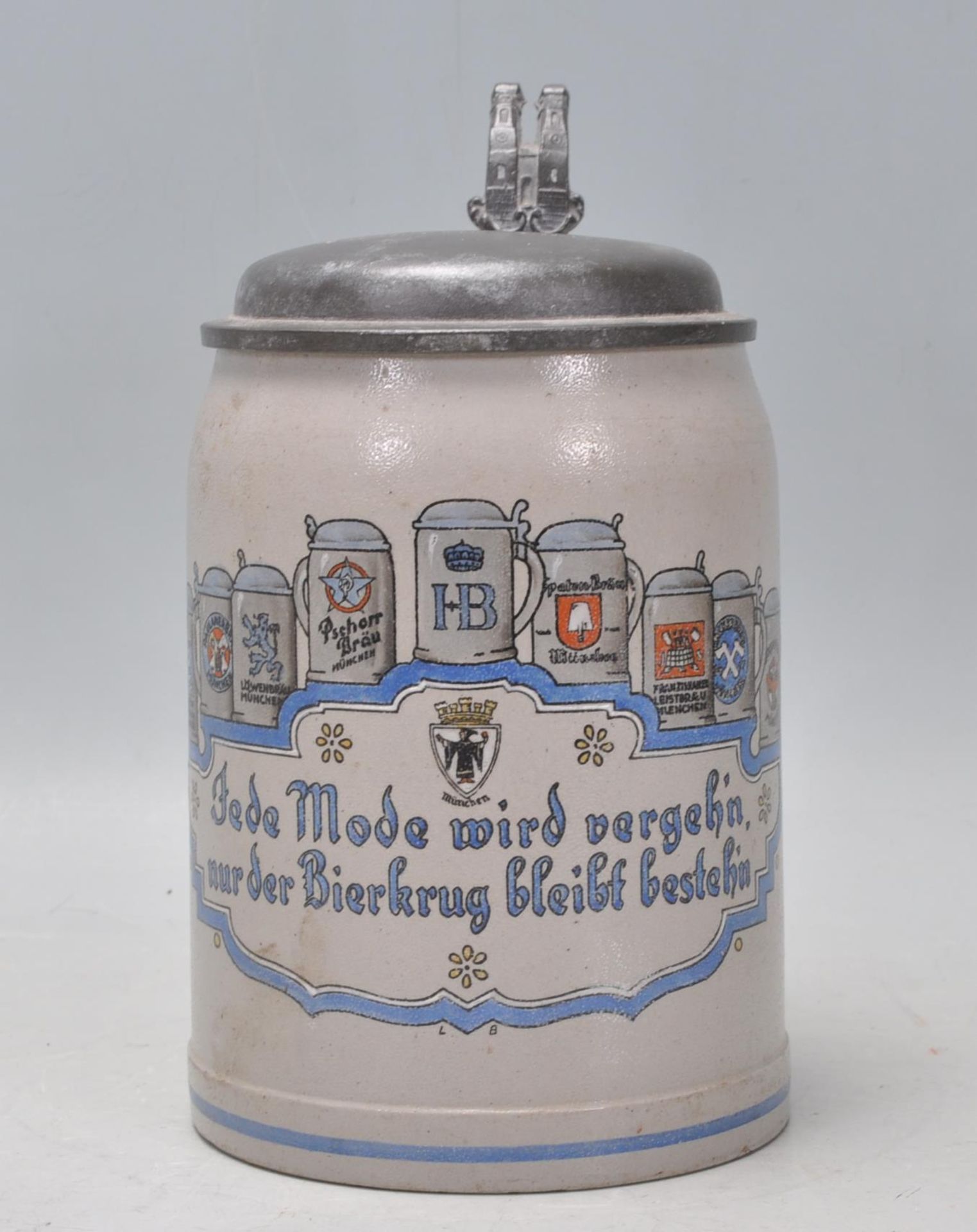 A vintage 20th Century German stoneware beer stein in the manner of Mettlack. The stein presented to
