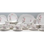 A large vintage German Mitterteich bone china dinner and tea service having moulded rims with