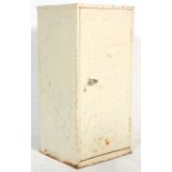 A mid 20th Century Industrial cabinet unit constructed from white metal having a single door with