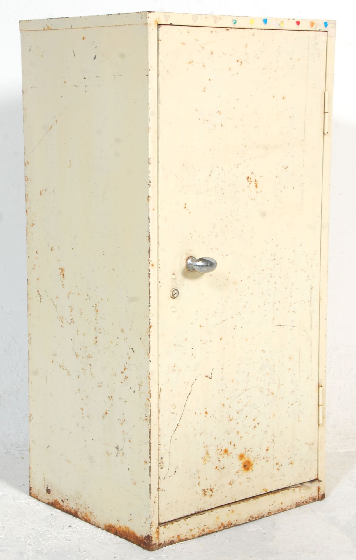 A mid 20th Century Industrial cabinet unit constructed from white metal having a single door with
