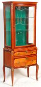 A 20th century French mahogany revival vitrine (display cabinet) of upright form being raised on