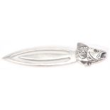 A stamped sterling sliver bookmark terminating in a fishes head finial set with red stone eyes.