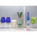 A mixed group of ceramic and glassware pieces to include a pair of crumpled rim wine glasses