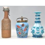 A collection of glassware to include a vintage Bohemian flash cut blue and white bottle vase, a