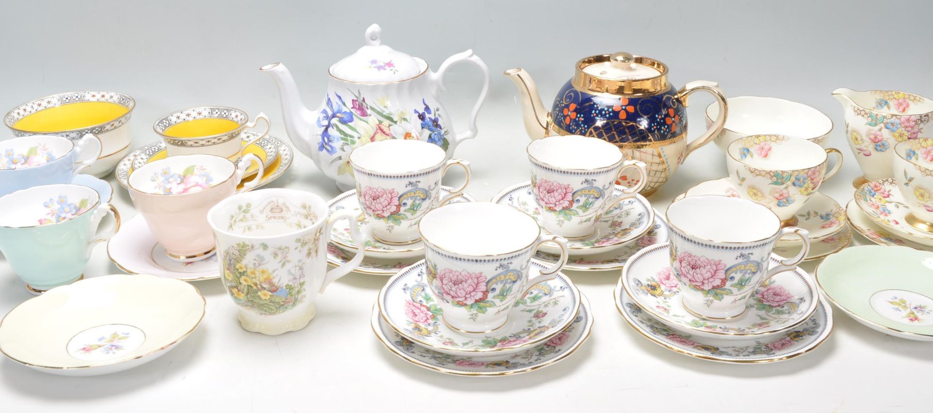 A collection of mixed vintage bone china tea service items, brands include Foley, Royal Doulton,
