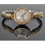 An early 20th Century Art Deco 9ct yellow gold ladies wrist watch having a decorative face with