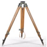 A good  early 20th century wooden and cast metal surveyors tripod stand. The tapering wooden legs