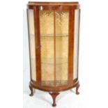 An early 20th Century 1930's Art Deco walnut demi lune display cabinet of good small proportions,