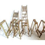 A set of six 20h Century industrial wooden trestles / table stands together with two vintage folding