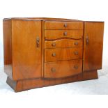 A 20th Century Art Deco 1940's walnut veneered sideboard credenza having a central bank of five