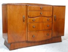 A 20th Century Art Deco 1940's walnut veneered sideboard credenza having a central bank of five