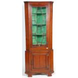 A 19th century mahogany George III bookcase corner